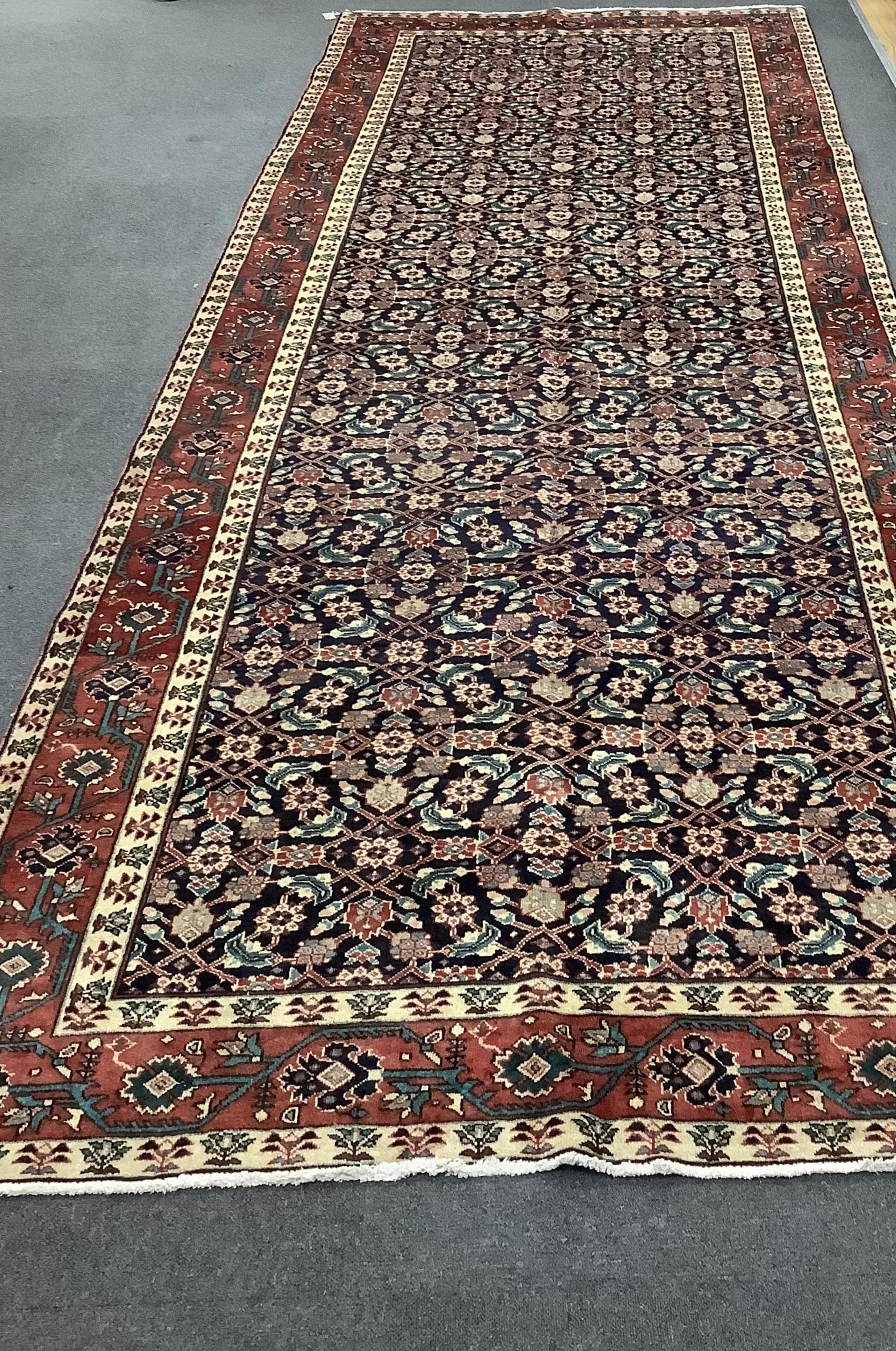 A Hamadan blue ground hall ground carpet, 430 x 160cm. Condition - good